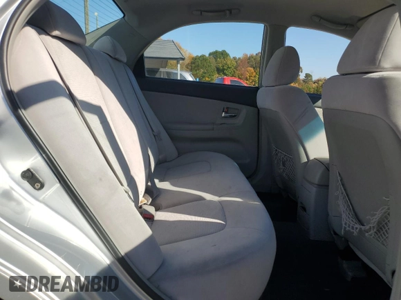 2007 Kia Spectra EX with VIN KNAFE121475450624, listed as a Copart auction lot 77712594 with 100,646 mi miles and Salvage Title. Bid and sale history available at carsss.com. Image 10.