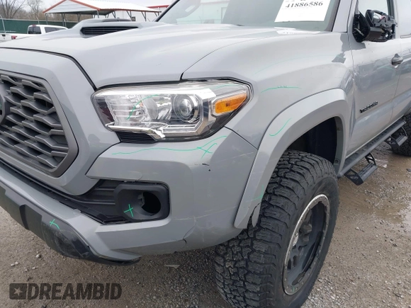 2021 Toyota Tacoma SR z VIN 3TMCZ5AN5MM372821, wystawiony jako IAAI lot #41886586 z przebiegiem 68 878 mil mil oraz . Historia ofert i sprzedaży dostępna na DreamBid. Obrazek 6.
