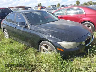 2014 BMW 3 Series 320i with VIN WBA3B1G50ENT01261, listed as a IAAI auction lot 40749275 with 1 mi miles. Bid and sale history available at carsss.com. Image 1.
