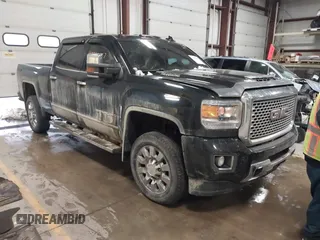 2017 GMC Sierra 2500HD Denali z VIN 1GT12UEY1HF212175, wystawiony jako IAAI lot #40998857 z przebiegiem 80 297 mil mil oraz . Historia ofert i sprzedaży dostępna na DreamBid. Obrazek 1.