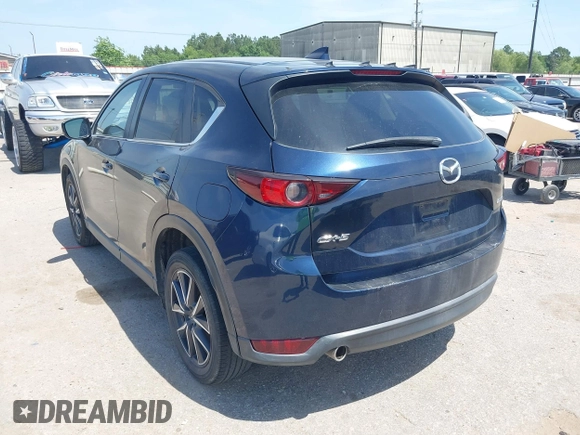 2018 Mazda CX-5 Touring z VIN JM3KFACM7J1410275, wystawiony jako IAAI lot #42248830 z przebiegiem 101 125 mil mil oraz . Historia ofert i sprzedaży dostępna na DreamBid. Obrazek 3.