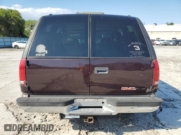 1997 GMC Yukon with VIN 1GKEK13R7VJ711782, listed as a Copart auction lot 74793184 with 208,718 mi miles and Salvage Title. Bid and sale history available at carsss.com. Image 6.