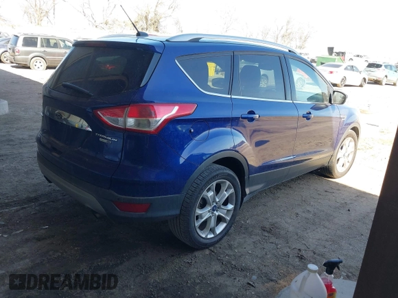 2016 Ford Escape Titanium with VIN 1FMCU9JXXGUB58961, listed as a IAAI auction lot 41772977 with 122,665 mi miles. Bid and sale history available at carsss.com. Image 4.
