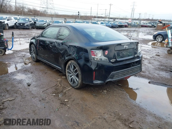 2014 Scion tC with VIN JTKJF5C74E3069104, listed as a IAAI auction lot 41579797 with 130,668 mi miles. Bid and sale history available at carsss.com. Image 3.