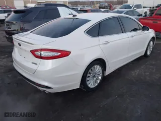2014 Ford Fusion Energi Titanium with VIN 3FA6P0SU8ER269351, listed as a IAAI auction lot 41145570 with 122,128 mi miles. Bid and sale history available at carsss.com. Image 4.