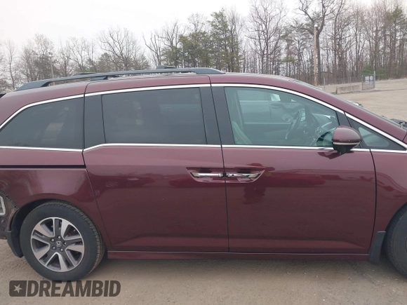 2014 Honda Odyssey Touring with VIN 5FNRL5H97EB117971, listed as a IAAI auction lot 41794324 with 198,191 mi miles and . Bid and sale history available at DreamBid. Image 13.