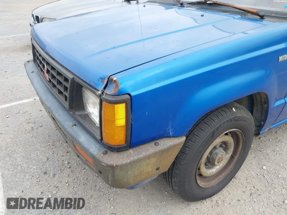 1990 Mitsubishi Mighty Max with VIN JA7FL24W8LP030657, listed as a IAAI auction lot 42014231 with 376,787 mi miles and . Bid and sale history available at DreamBid. Image 13.