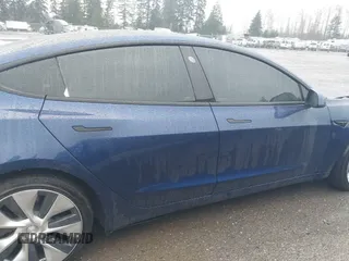 2022 Tesla Model 3 Long Range with VIN 5YJ3E1EB1NF142574, listed as a IAAI auction lot 41213900 with 127,404 mi miles and . Bid and sale history available at DreamBid. Image 13.