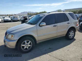 2004 Mercedes-Benz M-Class 5.0L with VIN 4JGAB75E64A488281, listed as a Copart auction lot 77031744 with 128,699 mi miles and Salvage Title. Bid and sale history available at carsss.com. Image 1.
