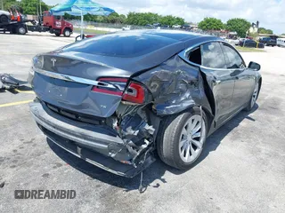2016 Tesla Model S 70 with VIN 5YJSA1E16GF156312, listed as a IAAI auction lot 42469451 with 90,317 mi miles and . Bid and sale history available at DreamBid. Image 6.