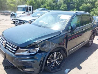2018 Volkswagen Tiguan SEL with VIN 3VV2B7AX9JM058518, listed as a IAAI auction lot 42558129 with 82,807 mi miles and . Bid and sale history available at DreamBid. Image 2.