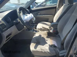 2007 Kia Spectra EX with VIN KNAFE121275411319, listed as a Copart auction lot 58716045 with 309,488 mi miles and Salvage title. Bid and sale history available at DreamBid. Image 7.