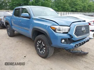 2019 Toyota Tacoma SR with VIN 3TMCZ5AN5KM209115, listed as a IAAI auction lot 42275594 with 106,082 mi miles and . Bid and sale history available at DreamBid. Image 1.
