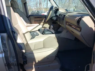 2000 Land Rover Discovery Cloth z VIN SALTY1247YA249969, wystawiony jako IAAI lot #41035905 z przebiegiem 188 643 mil mil oraz . Historia ofert i sprzedaży dostępna na DreamBid. Obrazek 5.