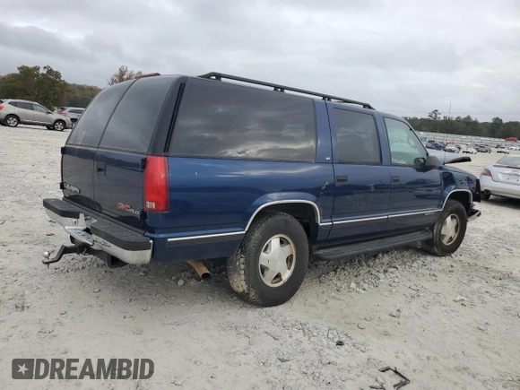1997 GMC Suburban with VIN 3GKFK16R4VG519902, listed as a Copart auction lot 79031204 with 195,624 mi miles and Salvage Title. Bid and sale history available at DreamBid. Image 3.