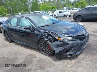 2023 Toyota Camry SE with VIN 4T1G11AK6PU829509, listed as a IAAI auction lot 42009085 with 35,864 mi miles and . Bid and sale history available at DreamBid. Image 1.