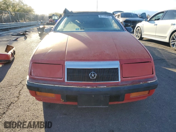 1989 Chrysler LeBaron z VIN 1C3XJ45K0KG251502, wystawiony jako Copart lot #87112404 z przebiegiem 166 445 mil mil oraz Tytuł czysty. Historia ofert i sprzedaży dostępna na DreamBid. Obrazek 5.