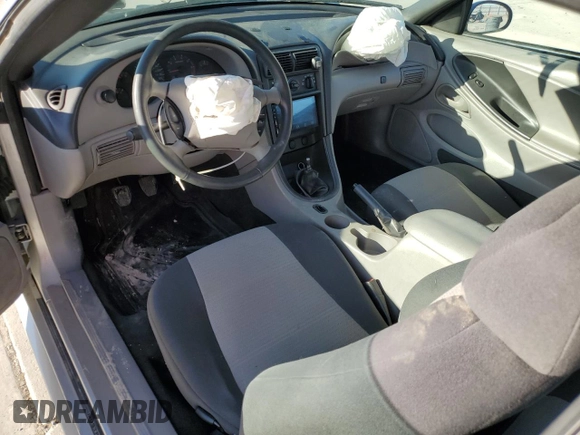 2003 Ford Mustang Standard z VIN 1FAFP40463F327722, wystawiony jako Copart lot #55042765 z przebiegiem 117 010 mil mil oraz Szkoda całkowita • Salvage title. Historia ofert i sprzedaży dostępna na DreamBid. Obrazek 8.
