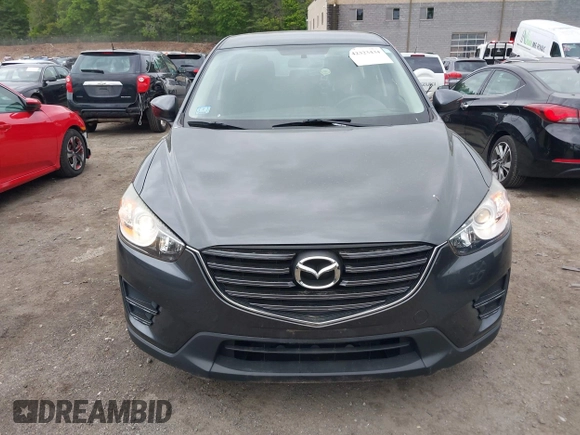 2016 Mazda CX-5 Sport with VIN JM3KE4BY9G0710004, listed as a IAAI auction lot 42323434 with 83,320 mi miles and . Bid and sale history available at DreamBid. Image 12.