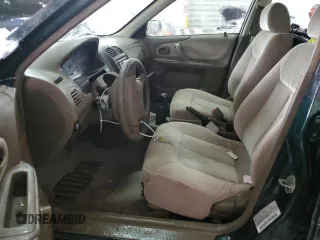 1999 Mazda Protege DX z VIN JM1BJ2220X0108600, wystawiony jako Copart lot #77004894 z przebiegiem 220 836 mil mil oraz Szkoda całkowita • Salvage title. Historia ofert i sprzedaży dostępna na DreamBid. Obrazek 7.