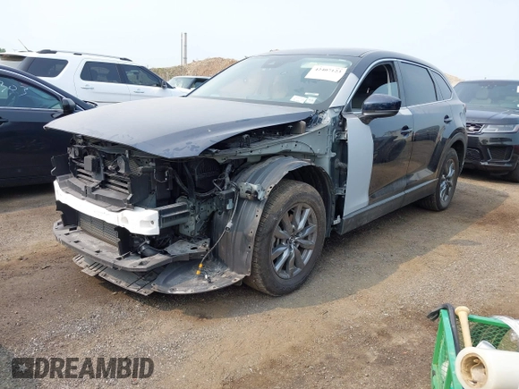 2023 Mazda CX-9 Touring with VIN JM3TCBCY6P0642838, listed as a IAAI auction lot 42407123 with 15,181 mi miles and . Bid and sale history available at DreamBid. Image 2.