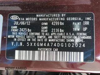 2013 Kia Optima LX z VIN 5XXGM4A74DG102024, wystawiony jako Copart lot #58264275 z przebiegiem 128 594 mil mil oraz Szkoda całkowita • Salvage title. Historia ofert i sprzedaży dostępna na DreamBid. Obrazek 12.