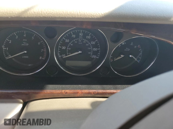 2004 Jaguar XJ with VIN SAJEA71C74SG02851, listed as a Copart auction lot 69056994 with 0 mi miles and Salvage Title. Bid and sale history available at carsss.com. Image 8.