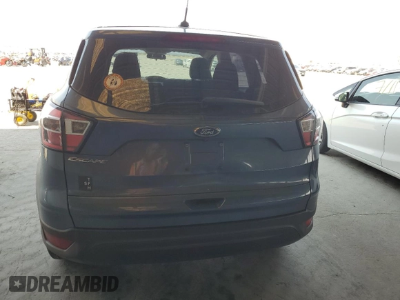 2018 Ford Escape S with VIN 1FMCU0F79JUB86844, listed as a Copart auction lot 64446735 with 155,329 mi miles and Salvage title. Bid and sale history available at DreamBid. Image 6.