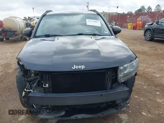 2014 Jeep Compass Sport with VIN 1C4NJCBA1ED725875, listed as a IAAI auction lot 42118863 with 133,136 mi miles. Bid and sale history available at carsss.com. Image 13.