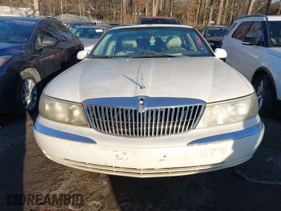 2001 Lincoln Continental with VIN 1LNHM97V71Y670611, listed as a IAAI auction lot 41385621 with 141,714 mi miles. Bid and sale history available at carsss.com. Image 6.