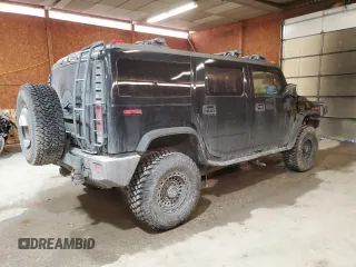 2006 Hummer H2 with VIN 5GRGN23U06H111389, listed as a Copart auction lot 88747715 with 182,628 mi miles and Salvage Title. Bid and sale history available at carsss.com. Image 3.