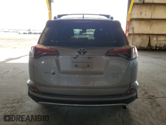 2018 Toyota RAV4 XLE with VIN JTMRFREV1JJ213808, listed as a Copart auction lot 54437805 with 56,972 mi miles and Salvage Title. Bid and sale history available at DreamBid. Image 6.