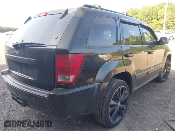 2005 Jeep Grand Cherokee Laredo z VIN 1J4GR48K65C725099, wystawiony jako IAAI lot #42509223 z przebiegiem 249 216 mil mil oraz . Historia ofert i sprzedaży dostępna na DreamBid. Obrazek 4.