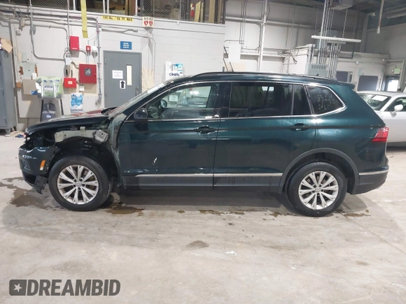 2018 Volkswagen Tiguan SEL with VIN 3VV2B7AX8JM113976, listed as a IAAI auction lot 42310576 with 100,319 mi miles and . Bid and sale history available at DreamBid. Image 14.