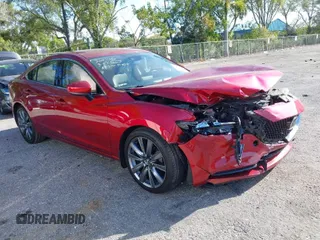 2018 Mazda 6 Grand Touring with VIN JM1GL1TY1J1302146, listed as a IAAI auction lot 41788881 with 55,852 mi miles and . Bid and sale history available at DreamBid. Image 1.