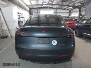 2023 Tesla Model Y Long Range with VIN 7SAYGDEE3PA034830, listed as a IAAI auction lot 41351397 with 26,704 mi miles. Bid and sale history available at carsss.com. Image 15.