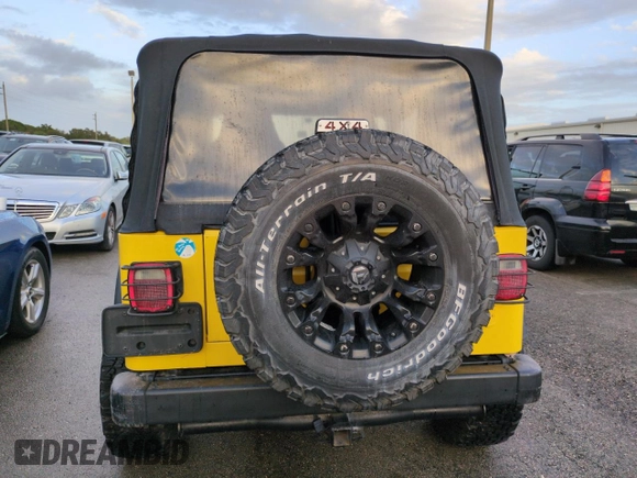 2003 Jeep Wrangler Sport with VIN 1J4FA49S93P373532, listed as a Copart auction lot 74595774 with 105,018 mi miles and Non Repairable. Bid and sale history available at carsss.com. Image 6.