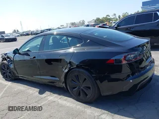 2022 Tesla Model S with VIN 5YJSA1E5XNF467435, listed as a IAAI auction lot 42538706 with 26,504 mi miles and . Bid and sale history available at DreamBid. Image 14.