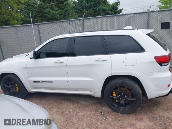 2021 Jeep Grand Cherokee Trackhawk with VIN 1C4RJFN95MC843131, listed as a IAAI auction lot 42688185 with 16,391 mi miles and . Bid and sale history available at DreamBid. Image 14.