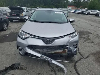 2018 Toyota RAV4 XLE with VIN 2T3RFREV8JW741461, listed as a Copart auction lot 57728244 with 88,925 mi miles and Salvage Title. Bid and sale history available at DreamBid. Image 5.