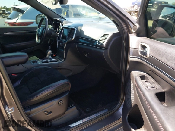 2017 Jeep Grand Cherokee Trailhawk with VIN 1C4RJFLG3HC877110, listed as a IAAI auction lot 42276506 with 144,993 mi miles and . Bid and sale history available at DreamBid. Image 5.
