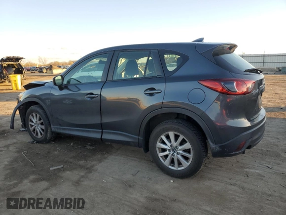 2016 Mazda CX-5 Sport with VIN JM3KE2BY9G0771969, listed as a Copart auction lot 80966064 with 99,348 mi miles and Salvage title. Bid and sale history available at DreamBid. Image 2.