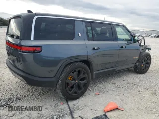 2022 Rivian R1S Launch Edition with VIN 7PDSGABL3NN000739, listed as a Copart auction lot 88127995 with 12,143 mi miles and Salvage Title. Bid and sale history available at DreamBid. Image 3.