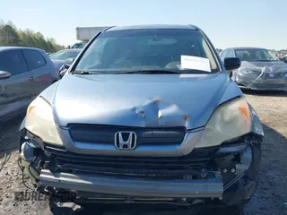 2007 Honda CR-V LX with VIN JHLRE38337C028847, listed as a IAAI auction lot 41910916 with 231,429 mi miles. Bid and sale history available at carsss.com. Image 12.