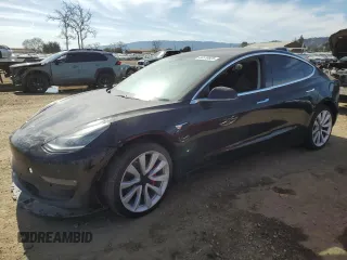 2019 Tesla Model 3 Mid Range with VIN 5YJ3E1EAXKF311719, listed as a Copart auction lot 44570825 with 143,034 mi miles and Salvage Title. Bid and sale history available at carsss.com. Image 1.