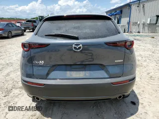 2022 Mazda CX-30 S Carbon Edition с VIN 3MVDMBCL0NM434395, выставлен на аукционе Copart как лот 56247715 с пробегом 40 698 миль миль и На запчасти • Non repairable. История ставок и продаж доступна на DreamBid. Изображение 6.