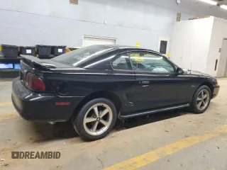 1997 Ford Mustang GT with VIN 1FALP42X4VF192088, listed as a Copart auction lot 84714114 with 194,845 mi miles and Salvage title. Bid and sale history available at DreamBid. Image 3.