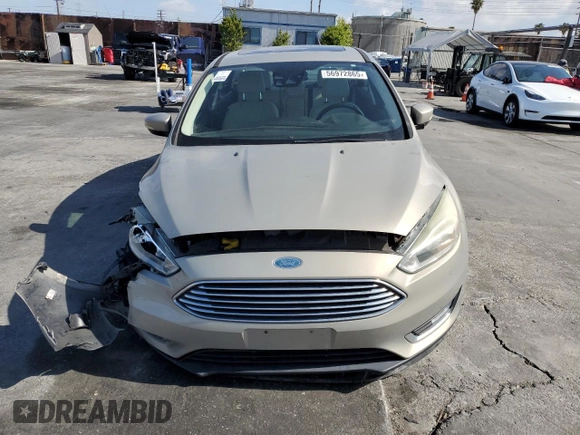 2015 Ford Focus Titanium с VIN 1FADP3J28FL288037, выставлен на аукционе Copart как лот 56972865 с пробегом 75 703 миль миль и Списание • Salvage title. История ставок и продаж доступна на DreamBid. Изображение 5.
