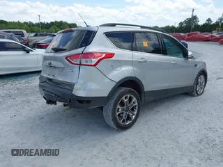 2016 Ford Escape SE with VIN 1FMCU9G92GUC28879, listed as a IAAI auction lot 42021065 with 99,184 mi miles. Bid and sale history available at carsss.com. Image 4.