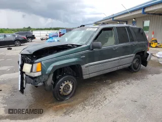 1995 Jeep Grand Cherokee Laredo with VIN 1J4FX58S8SC773884, listed as a Copart auction lot 56572555 with 424,126 mi miles and Salvage title. Bid and sale history available at DreamBid. Image 1.